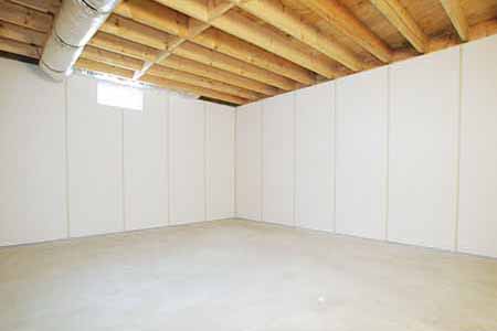 Clean, dry basement after wall protection and water-control work