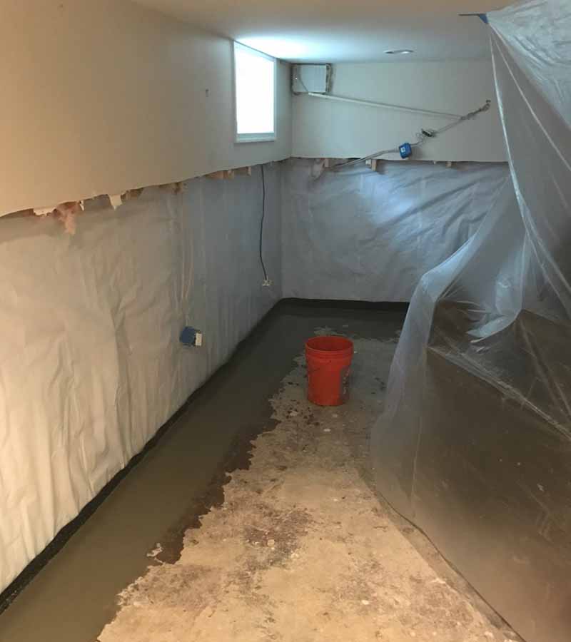 Interior perimeter drain and wall membrane installed during a Basement Detective waterproofing project